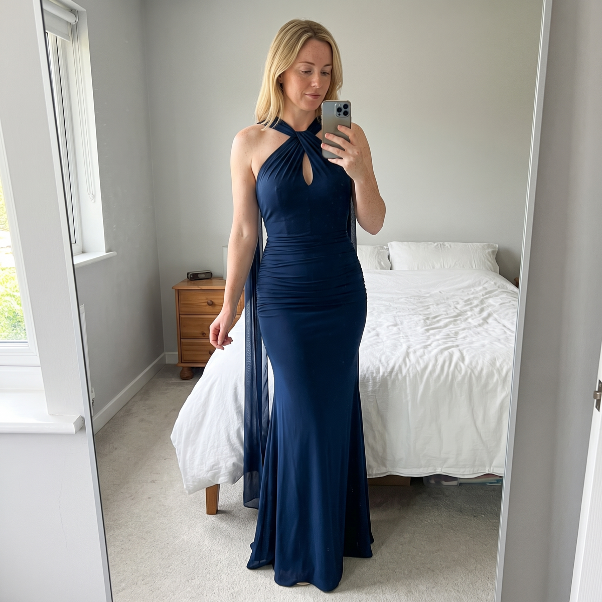 Navy Amara dress, model mirror styling photo